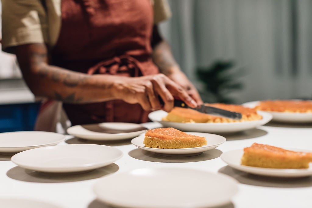 Slicing dessert plates at the kitchen counter