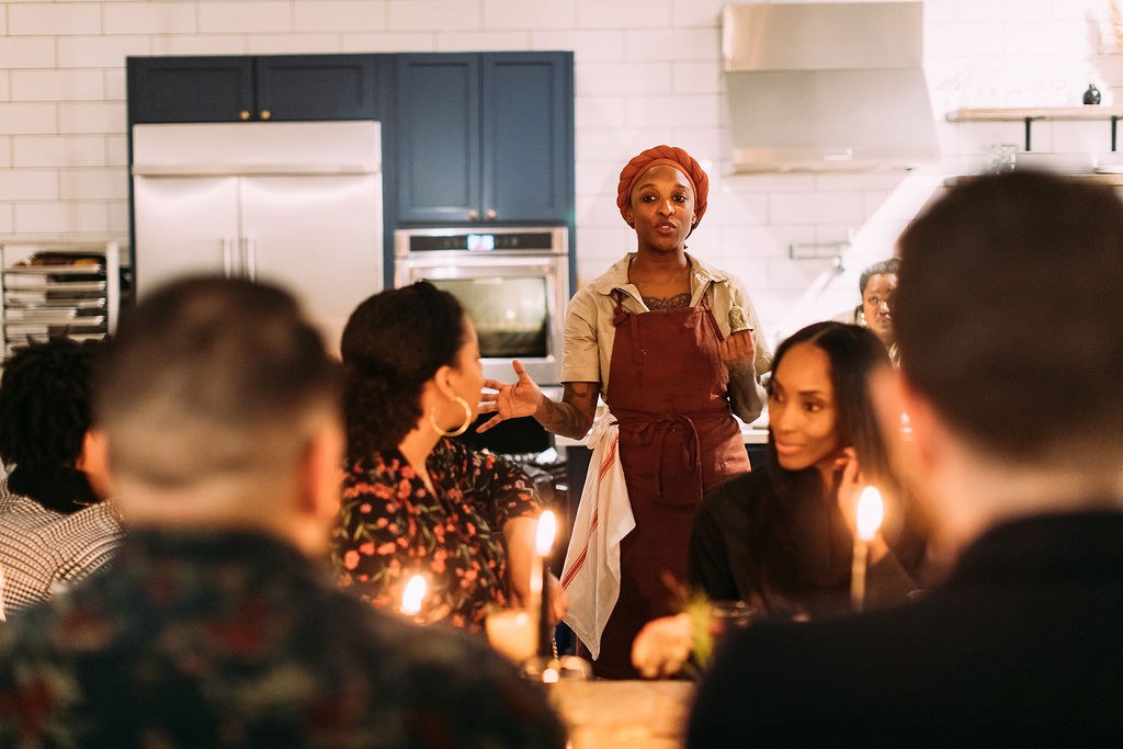 Mariya speaking at the table